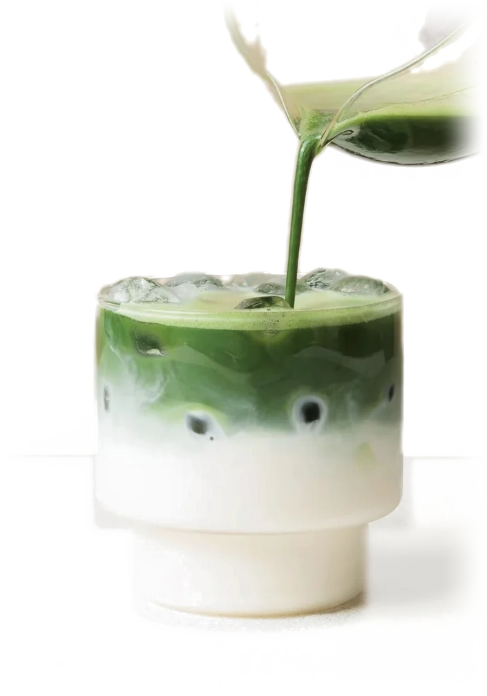 A fresh matcha shot poured into iced milk